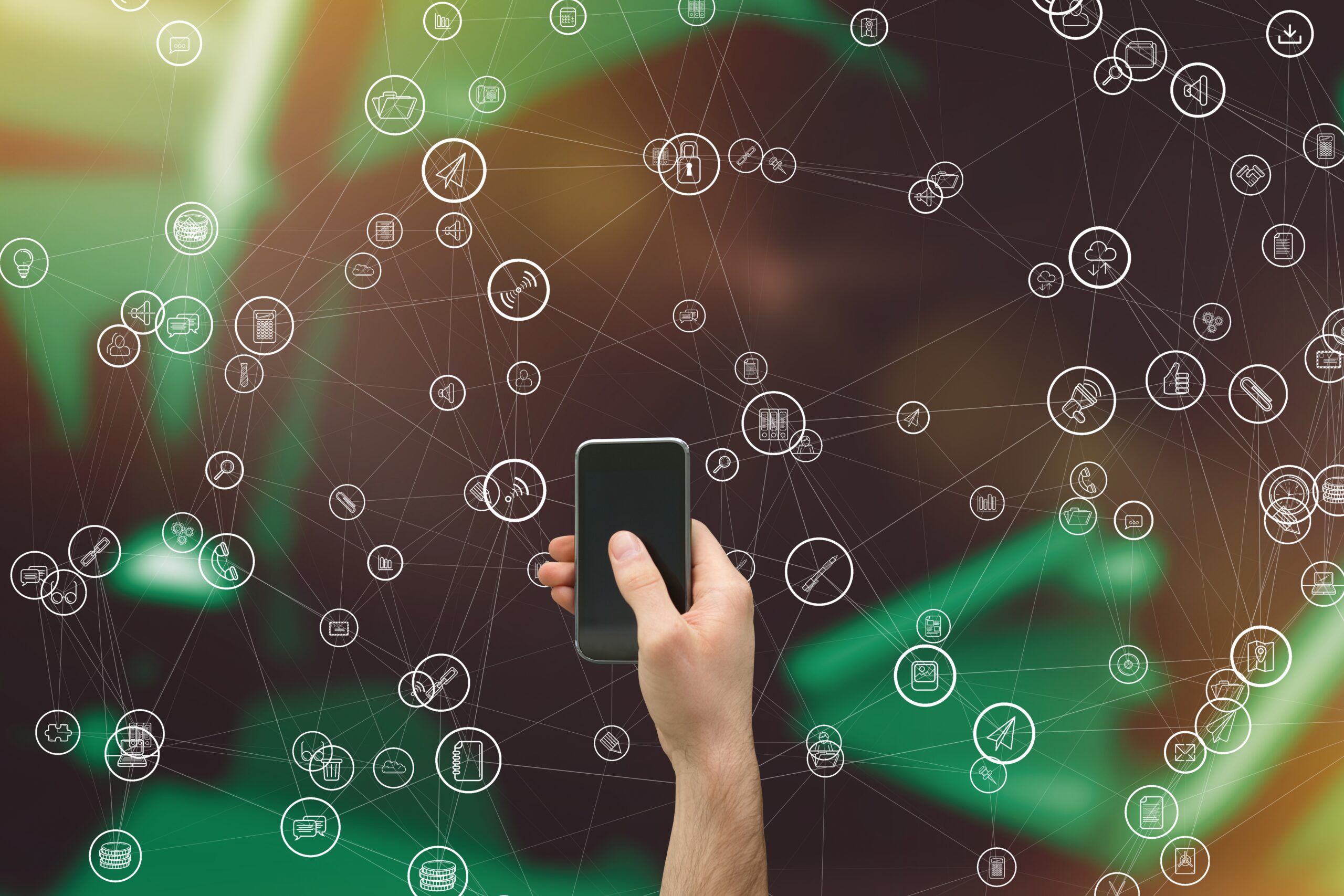 digital composite of hand holding smartphone with vignettes